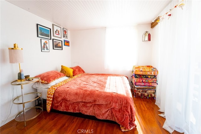 bedroom with wood-type flooring