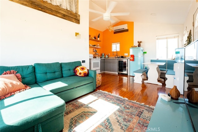 living room featuring lofted ceiling, dark wood-type flooring, a wall mounted air conditioner, beverage cooler, and ceiling fan