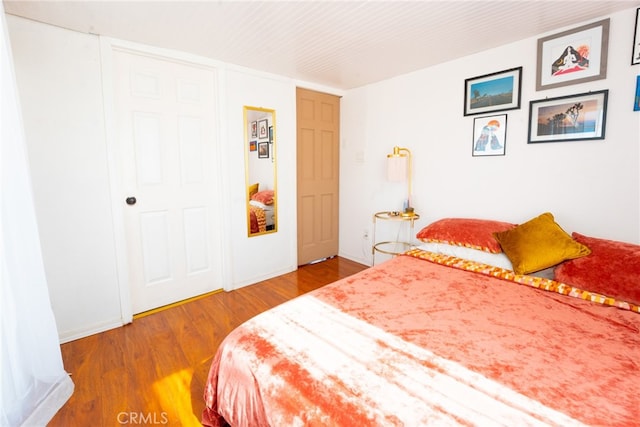 bedroom with wood-type flooring