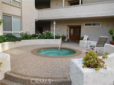 view of swimming pool with a patio