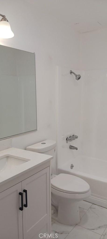 full bathroom featuring vanity, toilet, and washtub / shower combination