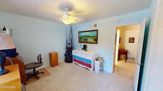 carpeted home office with ceiling fan