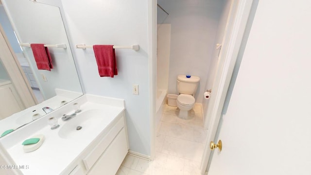 bathroom featuring tile patterned floors, vanity, and toilet