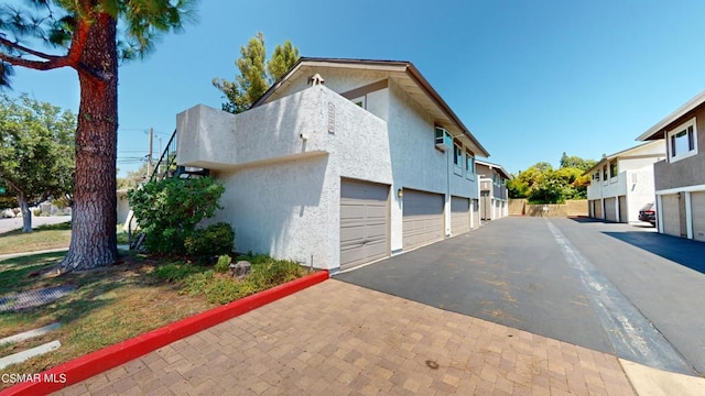 view of property exterior featuring a garage