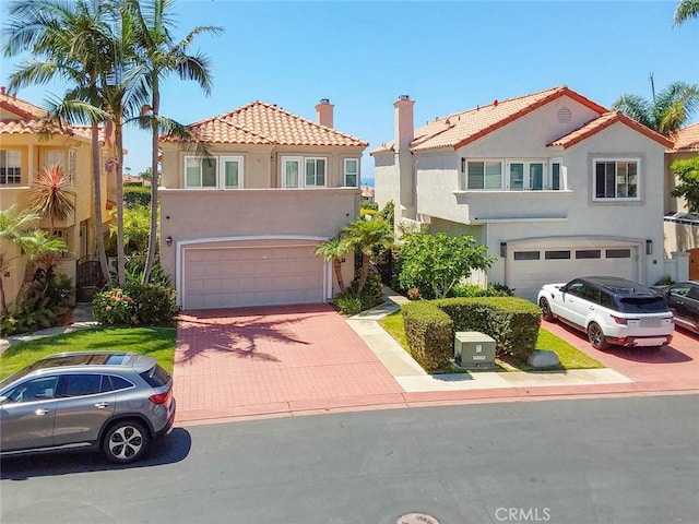 mediterranean / spanish-style house featuring a garage