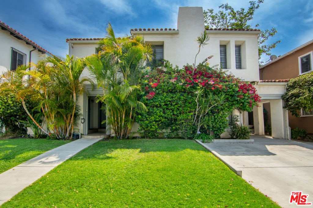 mediterranean / spanish-style house featuring a front lawn