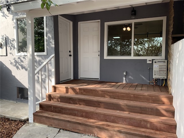 view of exterior entry featuring heating unit