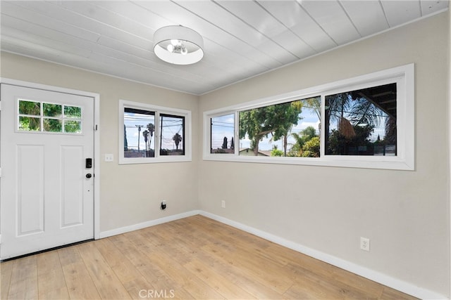 foyer entrance with light wood-type flooring