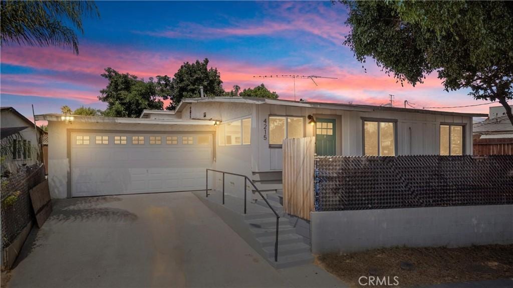 view of front of property with a garage