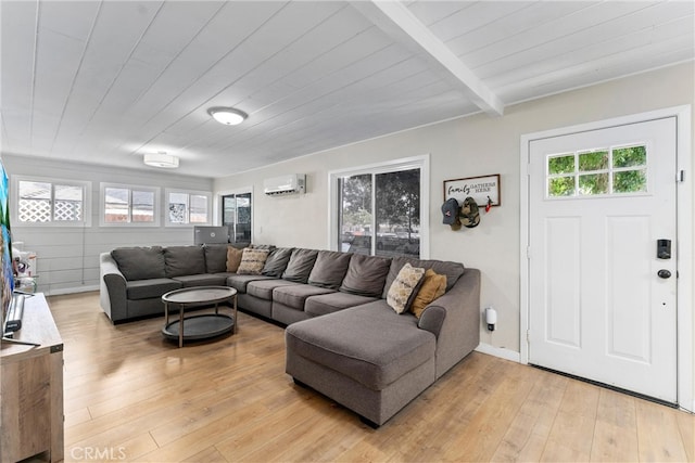 living room with beamed ceiling, wood-type flooring, an AC wall unit, and wood ceiling