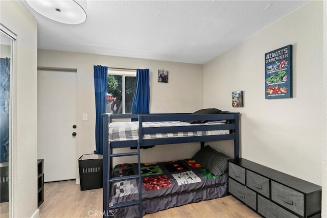 bedroom with light hardwood / wood-style floors