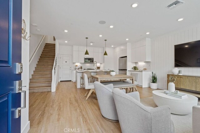 interior space with sink and light hardwood / wood-style floors