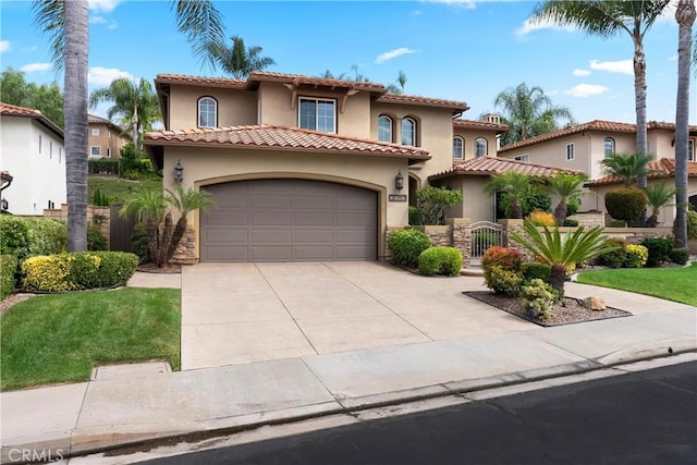 mediterranean / spanish house featuring a garage