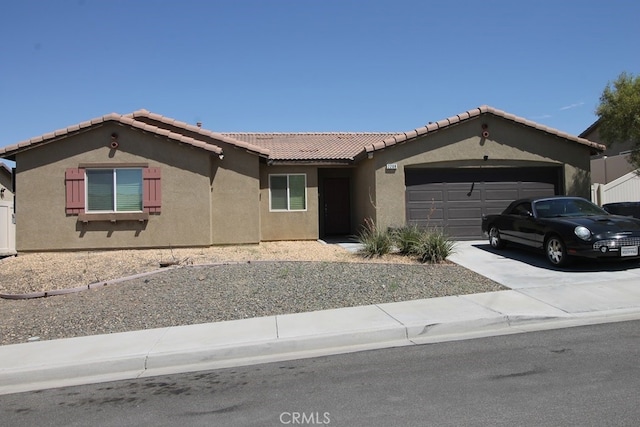 ranch-style home featuring a garage