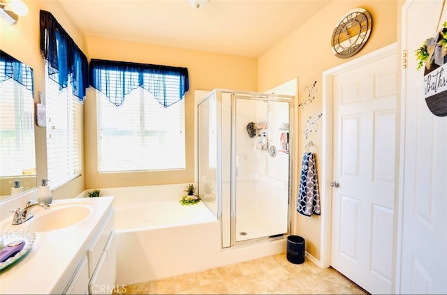 bathroom featuring vanity, tile patterned flooring, and plus walk in shower