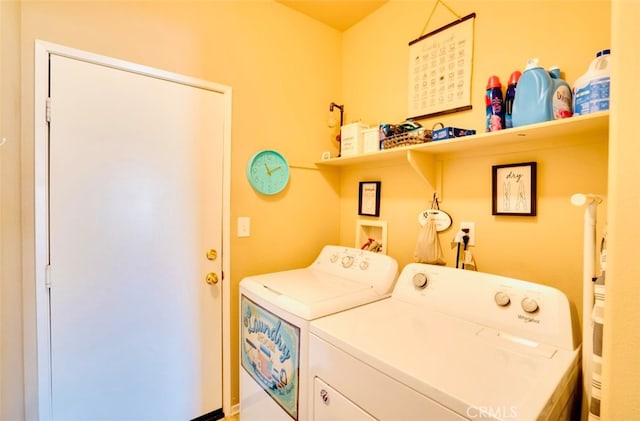 clothes washing area with independent washer and dryer