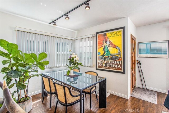 dining room featuring dark hardwood / wood-style flooring