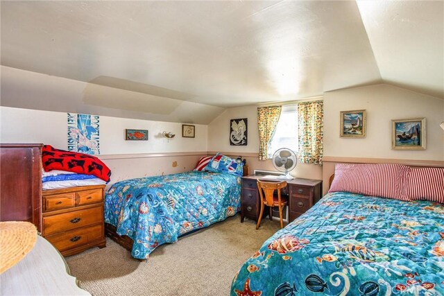 carpeted bedroom featuring vaulted ceiling