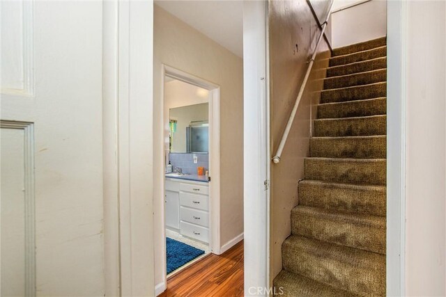 stairway with wood-type flooring