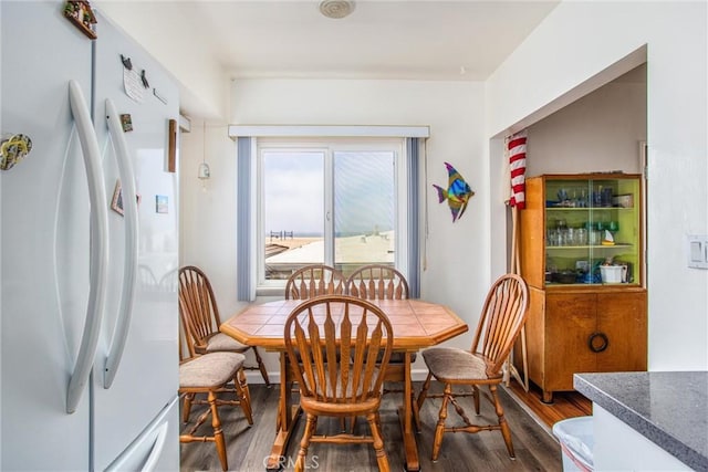 dining area with wood-type flooring