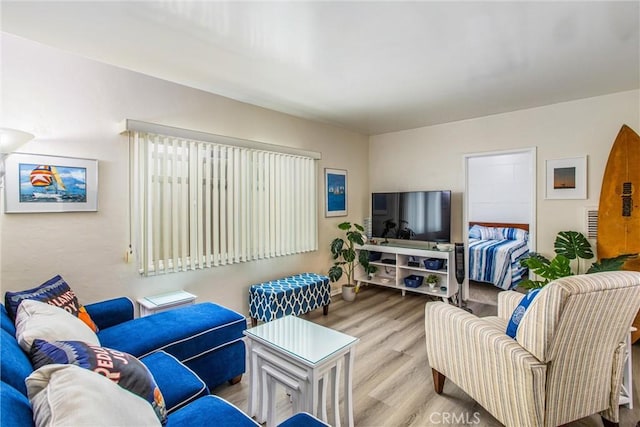 living room with light hardwood / wood-style flooring