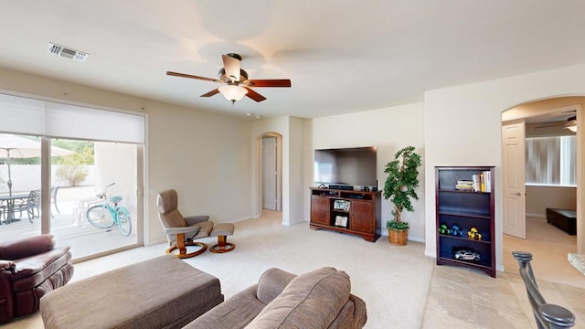 living room featuring ceiling fan and light colored carpet