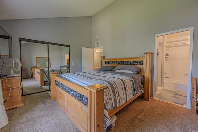 carpeted bedroom featuring high vaulted ceiling and a closet