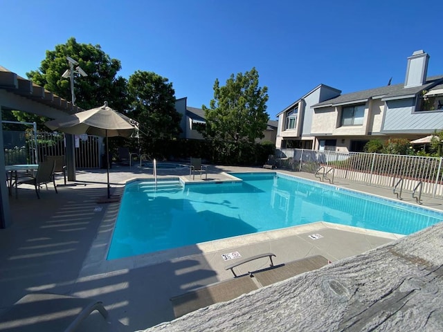 view of swimming pool with a patio area