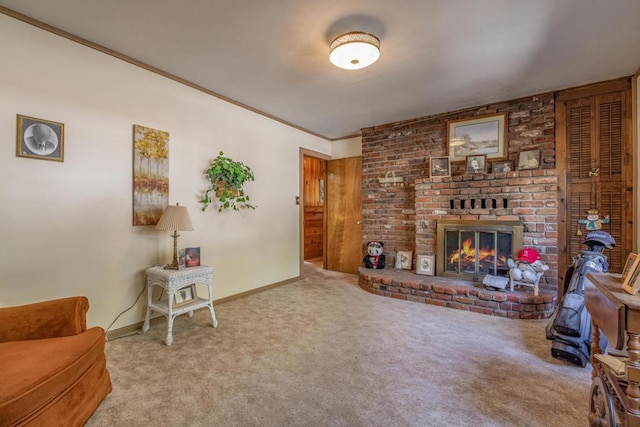 carpeted living room featuring a brick fireplace and crown molding