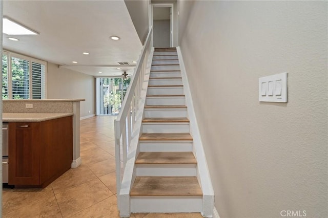 stairs with tile patterned flooring