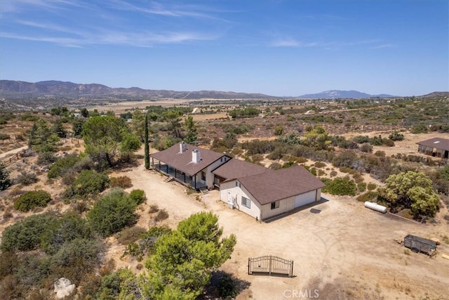 birds eye view of property with a mountain view