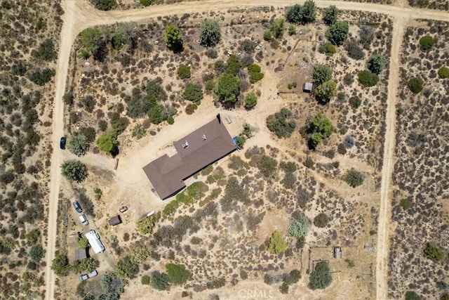 birds eye view of property with a rural view