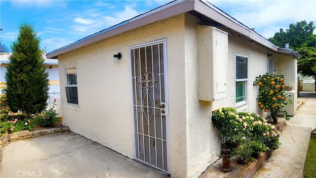 exterior space featuring stucco siding