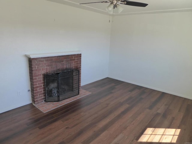 unfurnished living room with a fireplace, dark hardwood / wood-style flooring, and ceiling fan