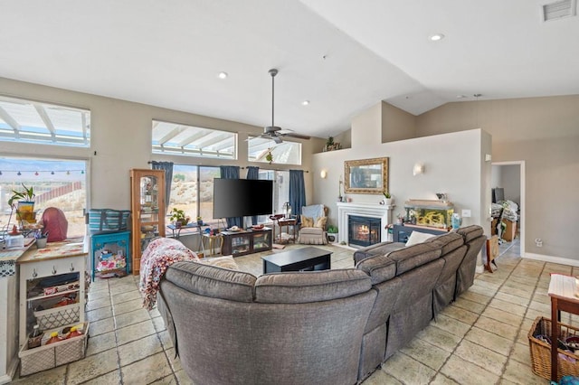 living room featuring vaulted ceiling and ceiling fan