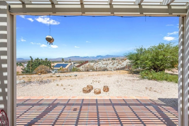 view of patio with a mountain view and a pergola