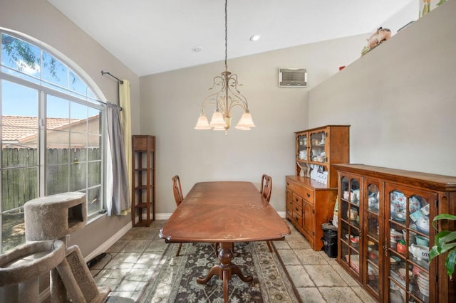 dining room featuring vaulted ceiling and a notable chandelier