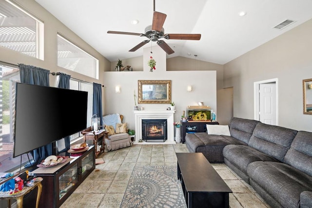 living room with ceiling fan and high vaulted ceiling