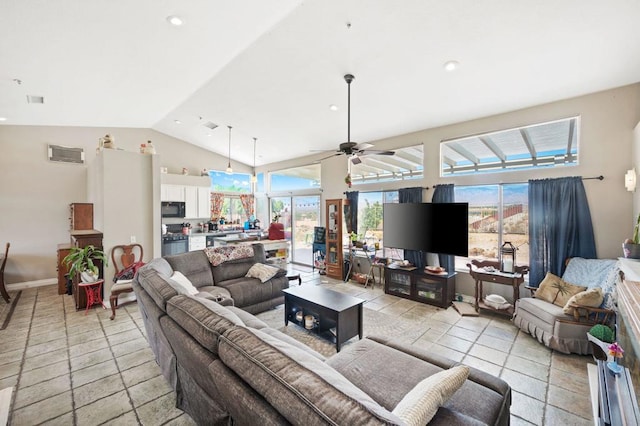 living room featuring ceiling fan and lofted ceiling