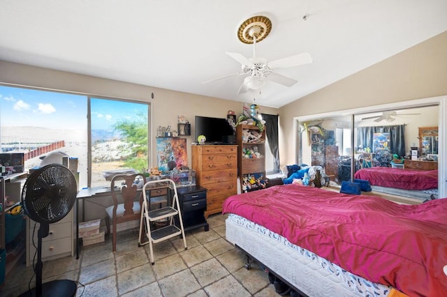 bedroom featuring multiple windows, vaulted ceiling, and ceiling fan