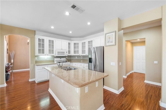 kitchen featuring sink, a kitchen island with sink, white cabinetry, dark hardwood / wood-style floors, and stainless steel refrigerator with ice dispenser