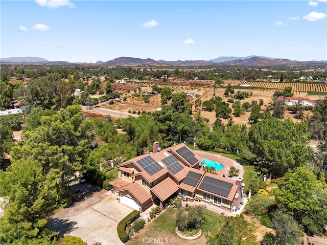 birds eye view of property with a mountain view