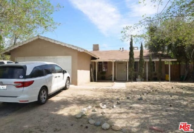 single story home with a garage