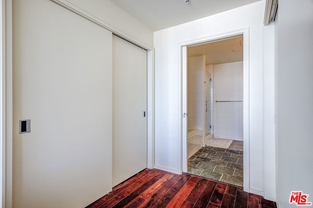 hall with dark hardwood / wood-style floors