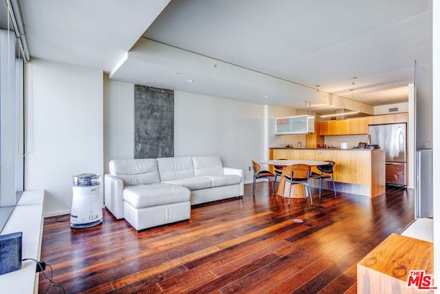 living room with dark hardwood / wood-style floors