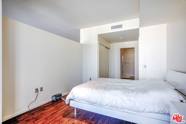 bedroom featuring hardwood / wood-style floors