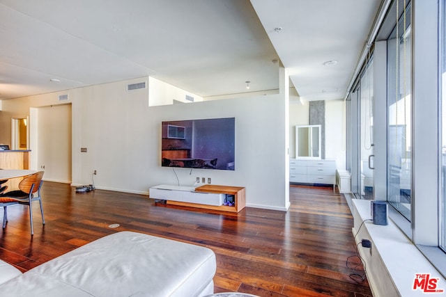 living room with dark hardwood / wood-style flooring