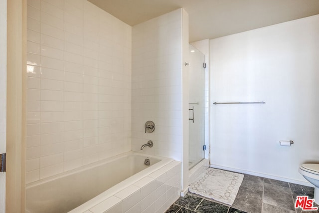 bathroom with toilet and tile patterned floors