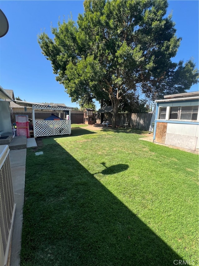 view of yard featuring central air condition unit