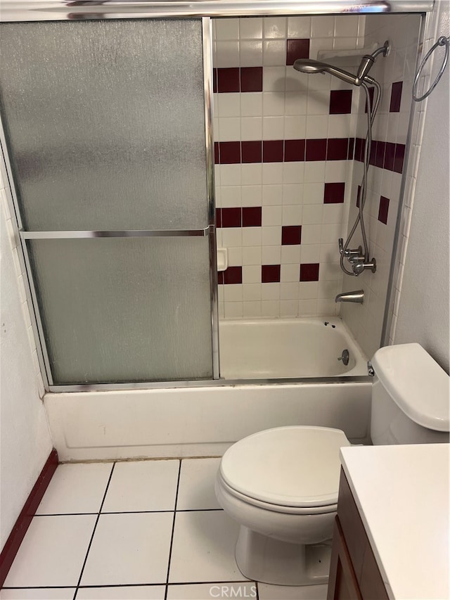 full bathroom with enclosed tub / shower combo, vanity, toilet, and tile patterned floors